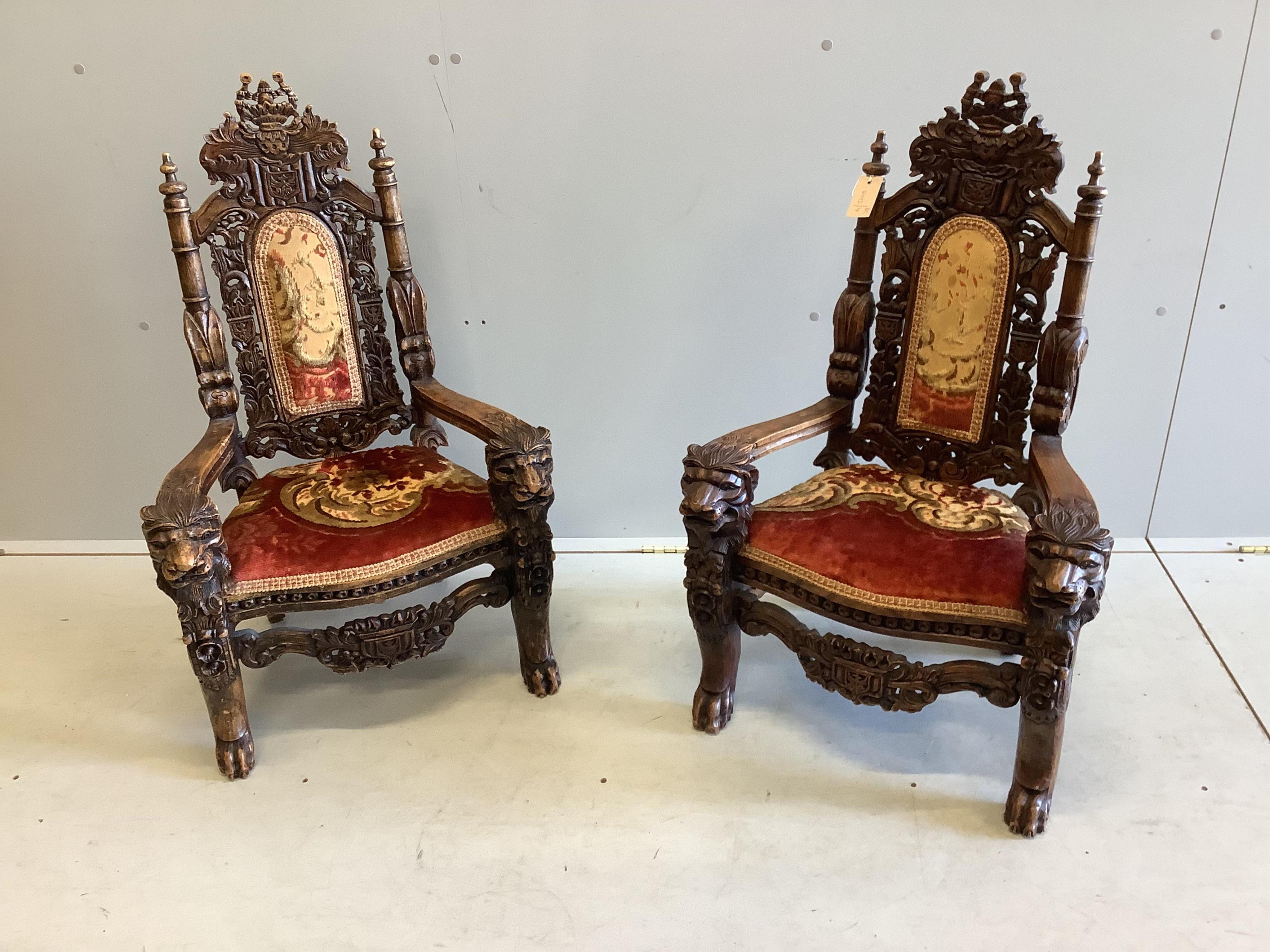 A near pair of 18th century style carved beech child's elbow chairs, larger width 55cm, depth 39cm, height 90cm. Condition - fair